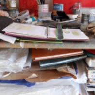 studio-sketch-books-and-collage-materials-taking-over-the-workspace